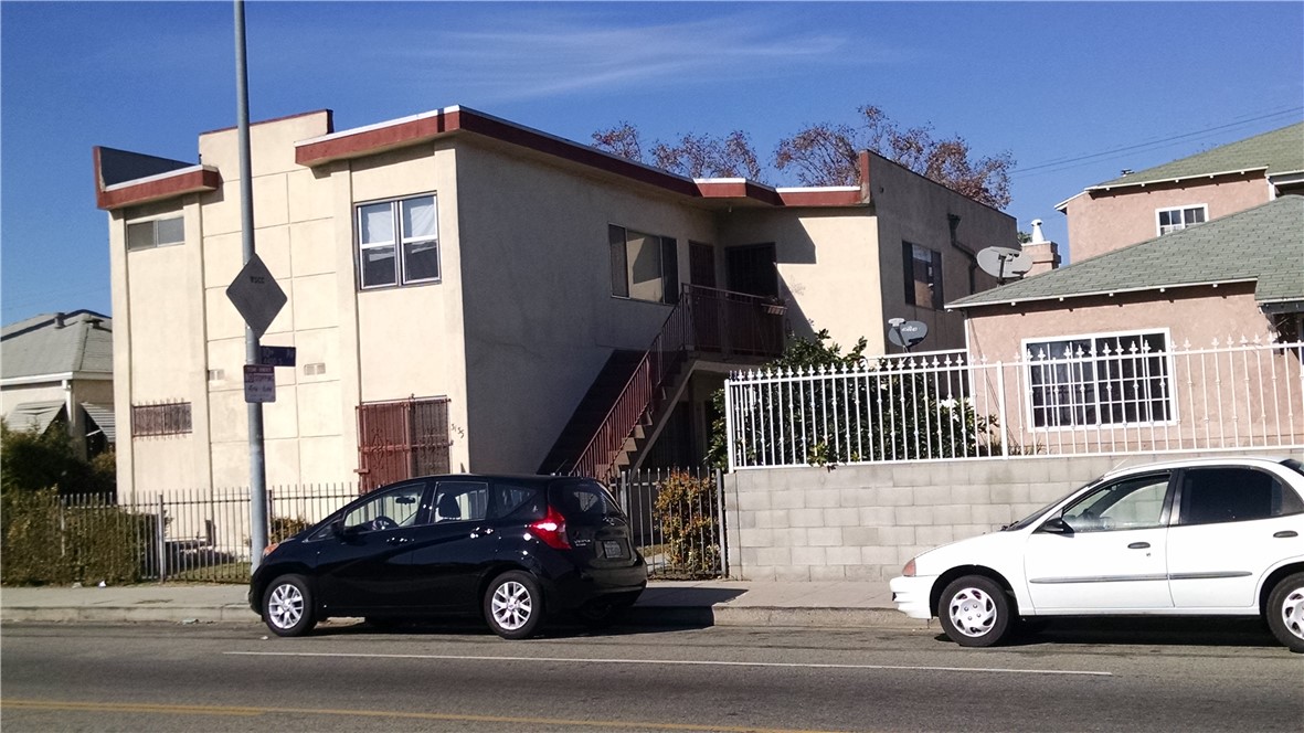 a view of a car parked in front of a house