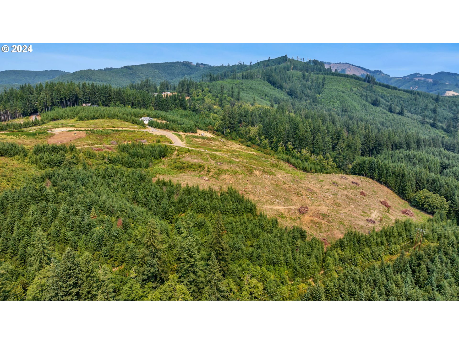 a open area with mountains in the background