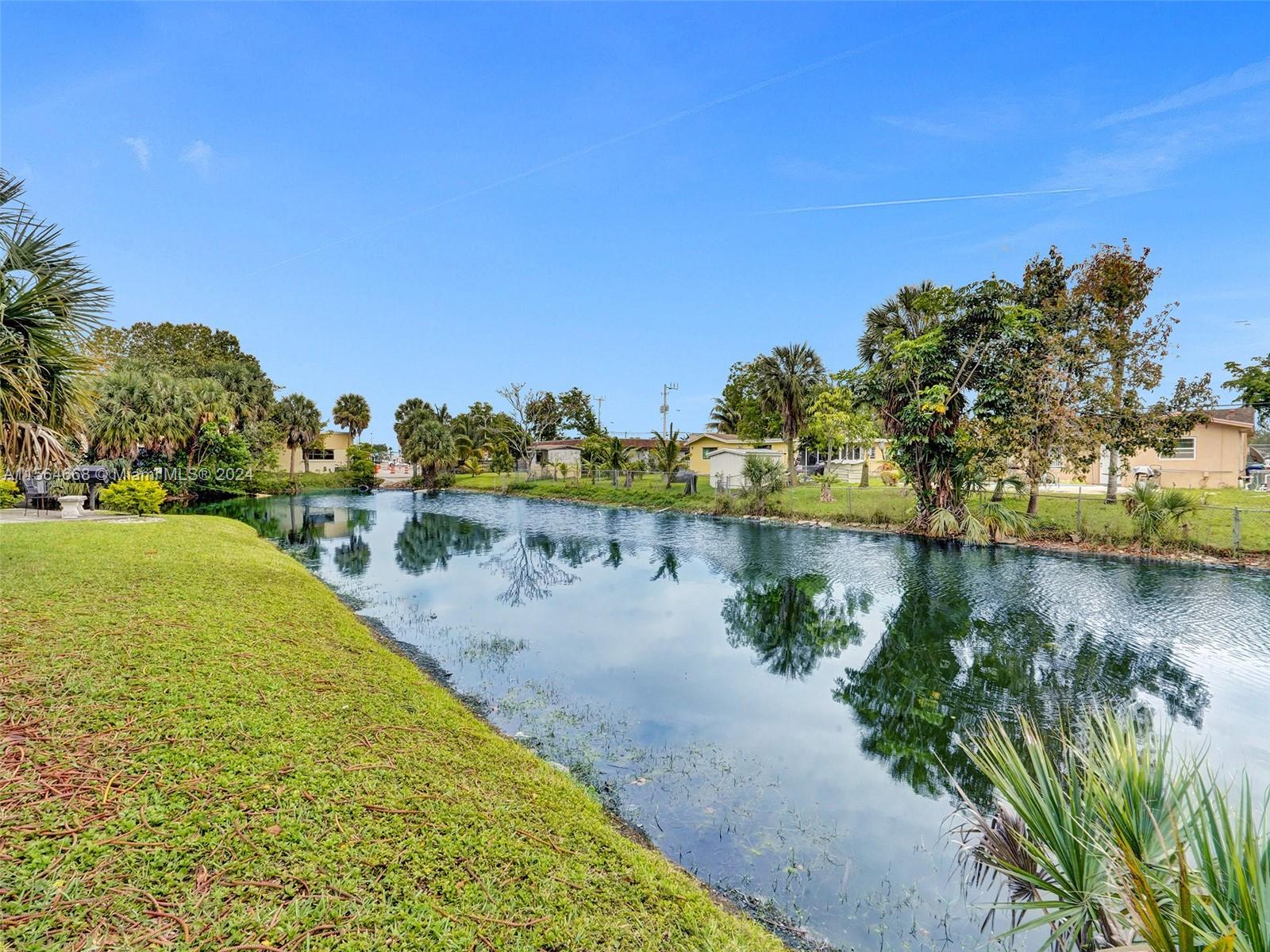 a view of a lake with a yard