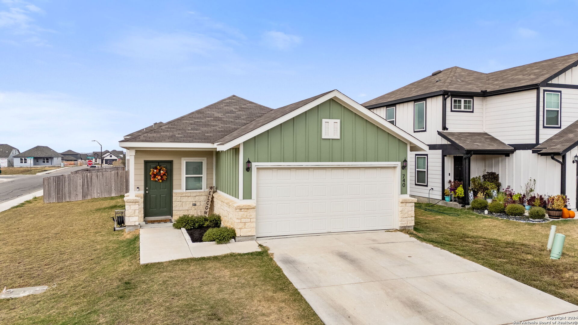 a front view of a house with a yard