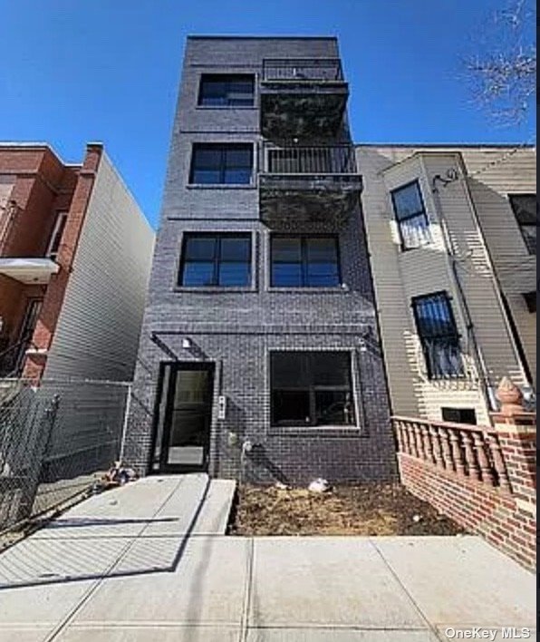 a front view of a house with a balcony