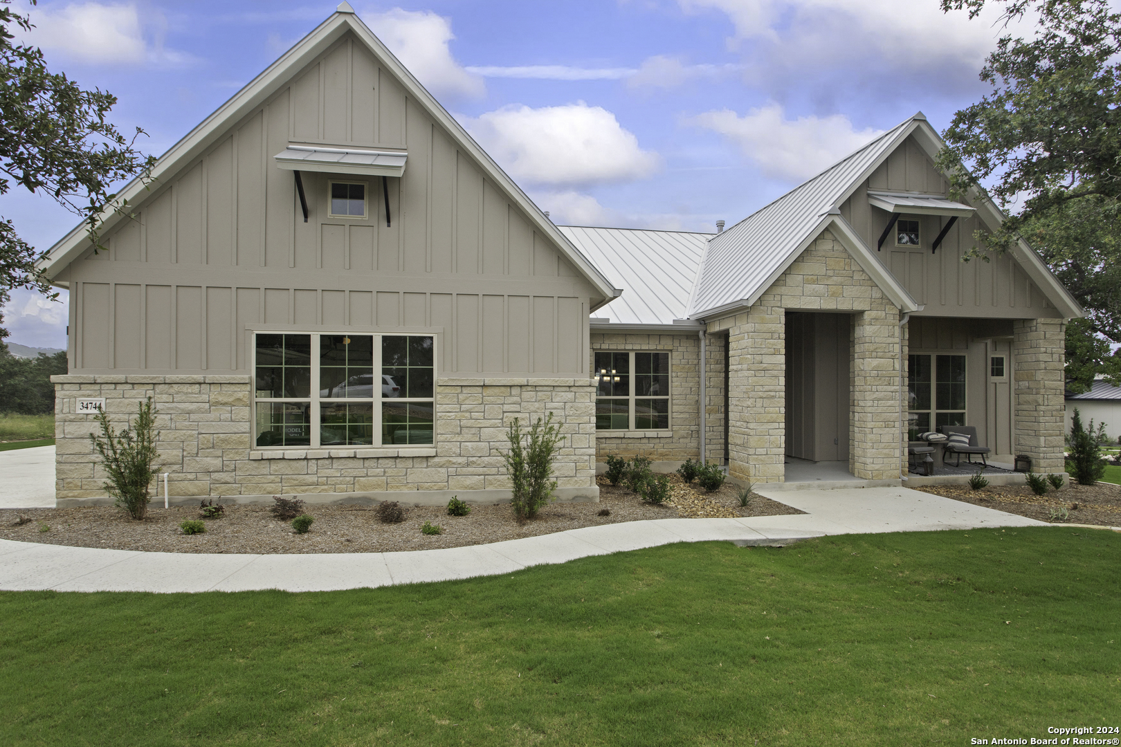 a front view of house with yard and green space