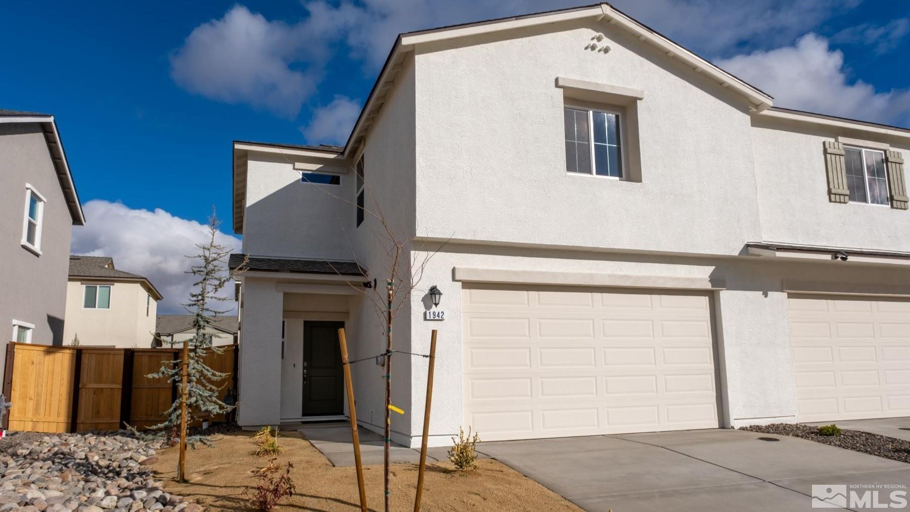 a front view of a house with parking