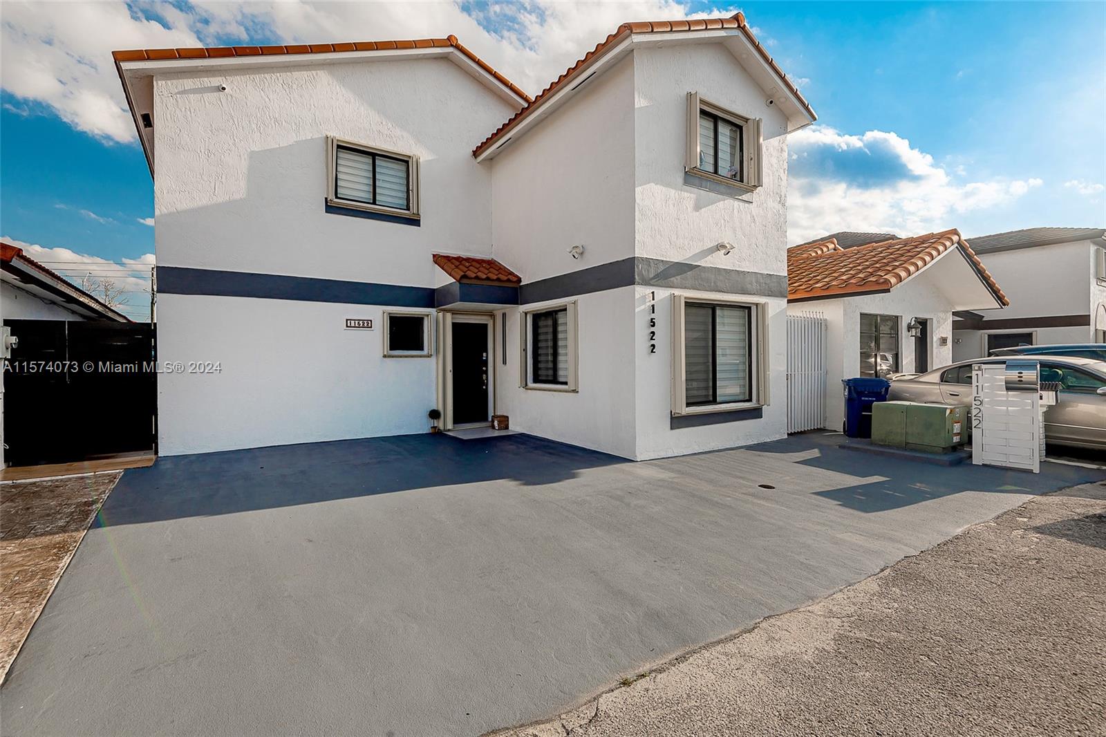 a front view of a house with a garage