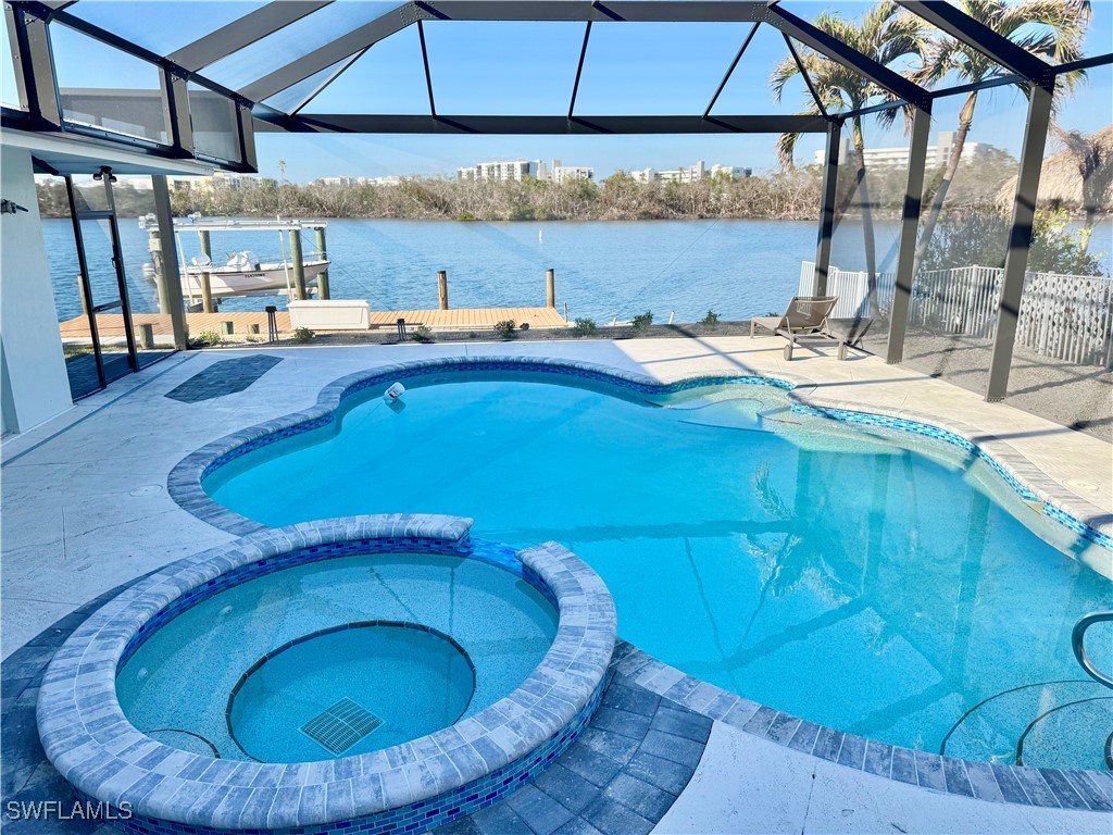 a view of a swimming pool with a lounge chairs