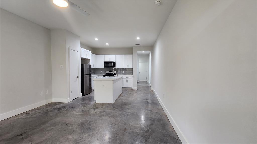 a view of a kitchen with a sink