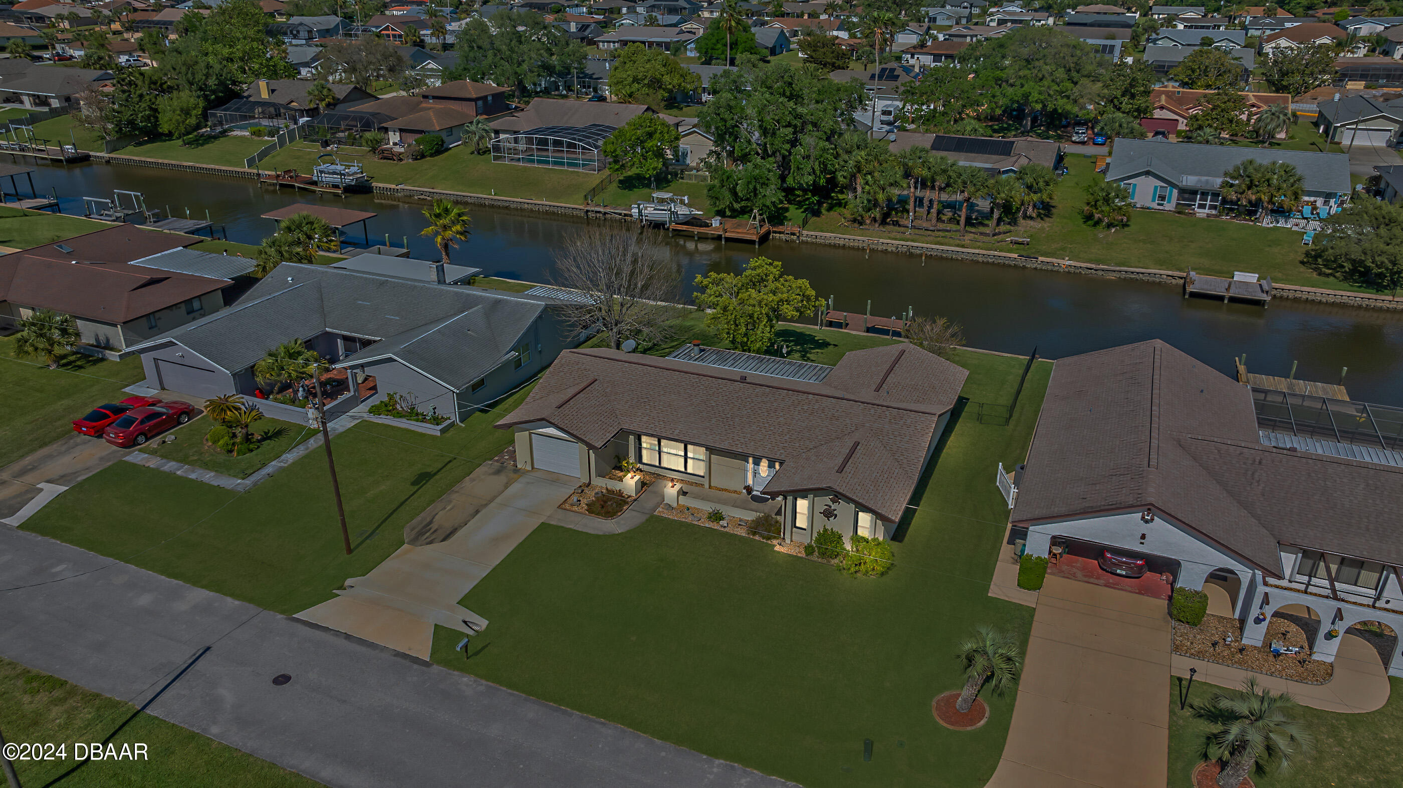 an aerial view of a house with a lake view