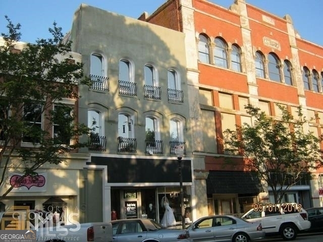 a view of a building with a street