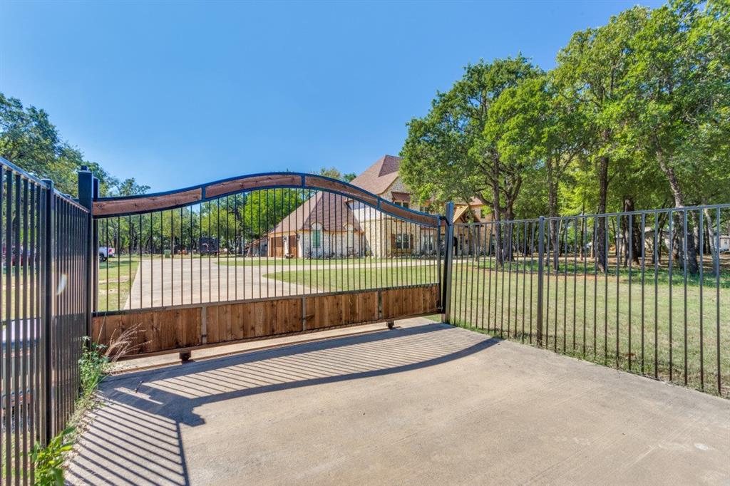 a view of a deck with a fence and a floor to ceiling window