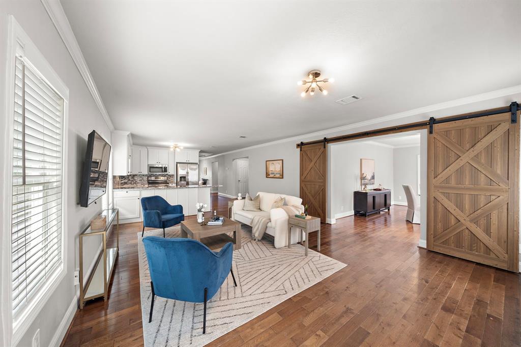 a living room with fireplace furniture and a flat screen tv