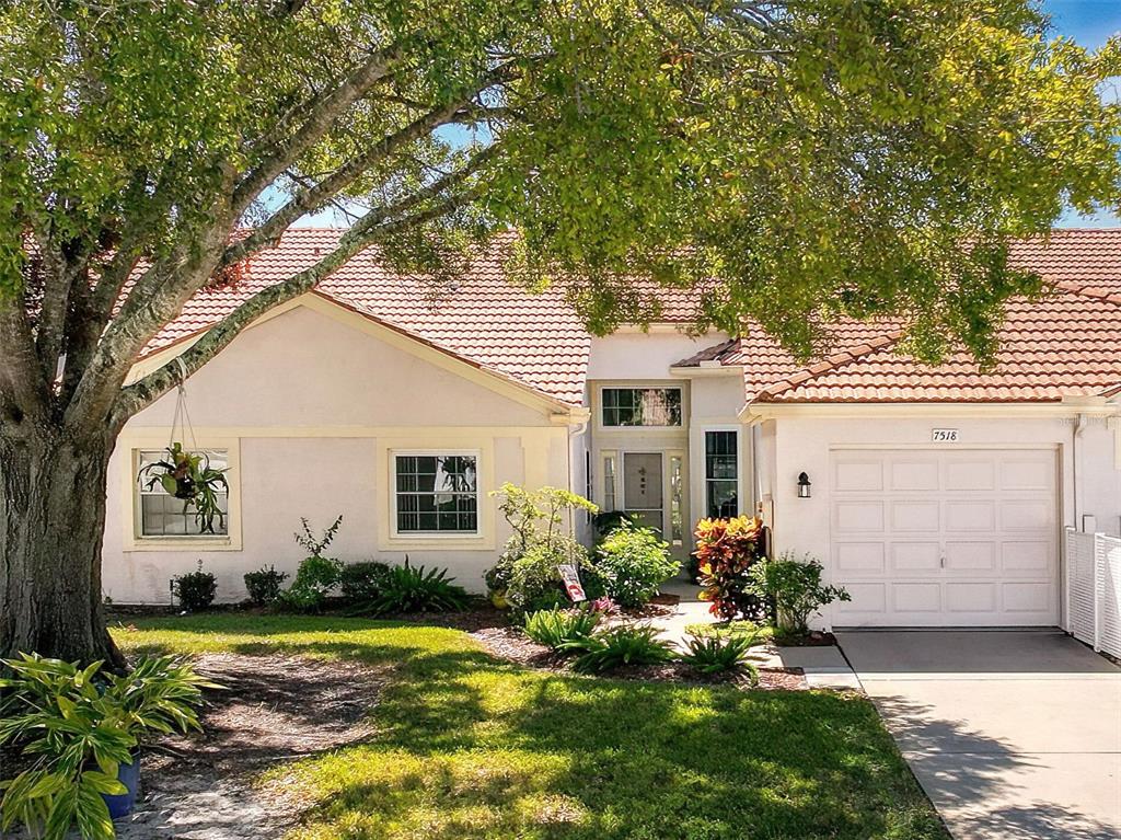 a view of a house with a yard