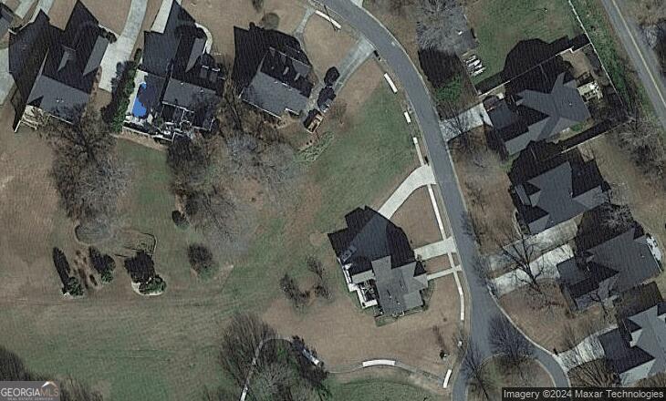 an aerial view of houses with outdoor space