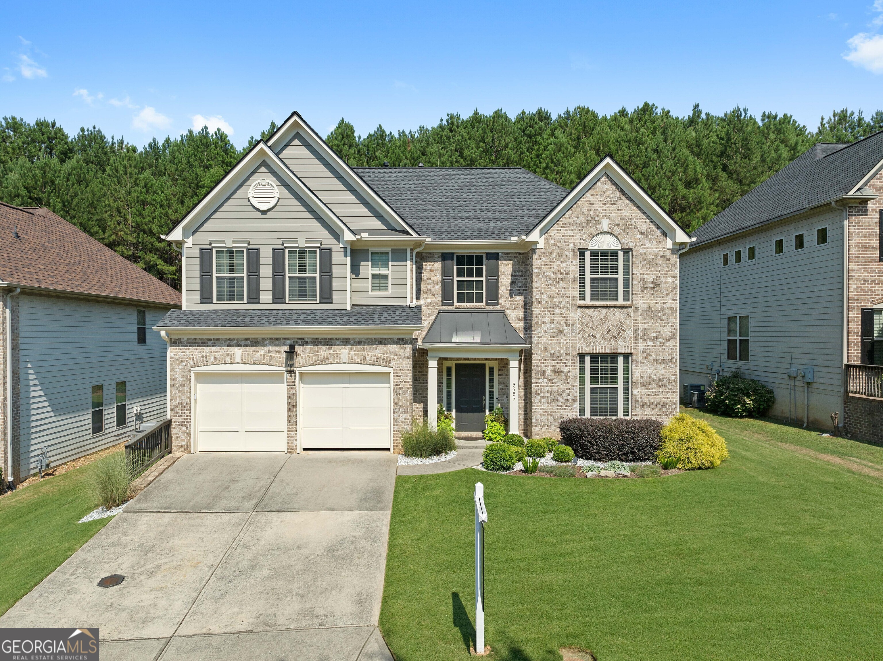 a front view of a house with a yard