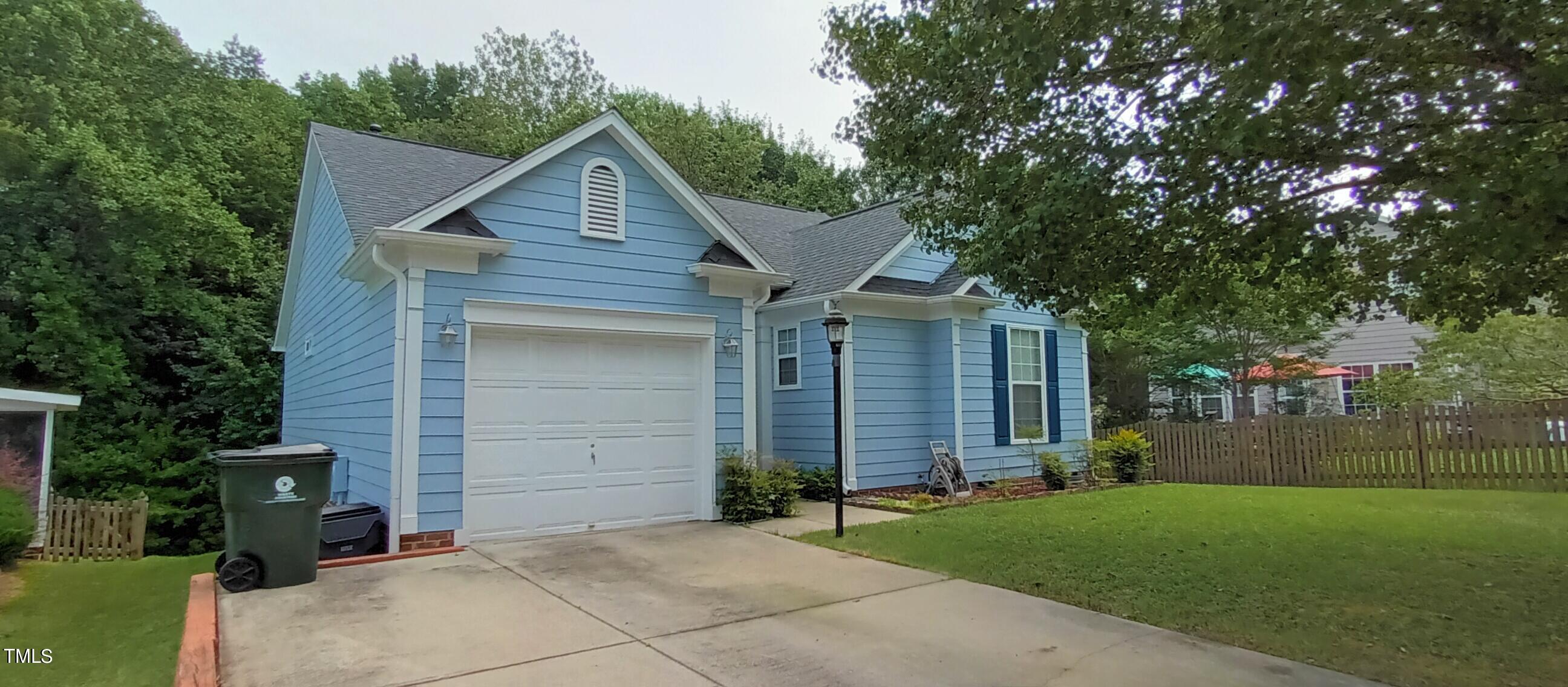 front view of a house with a garden