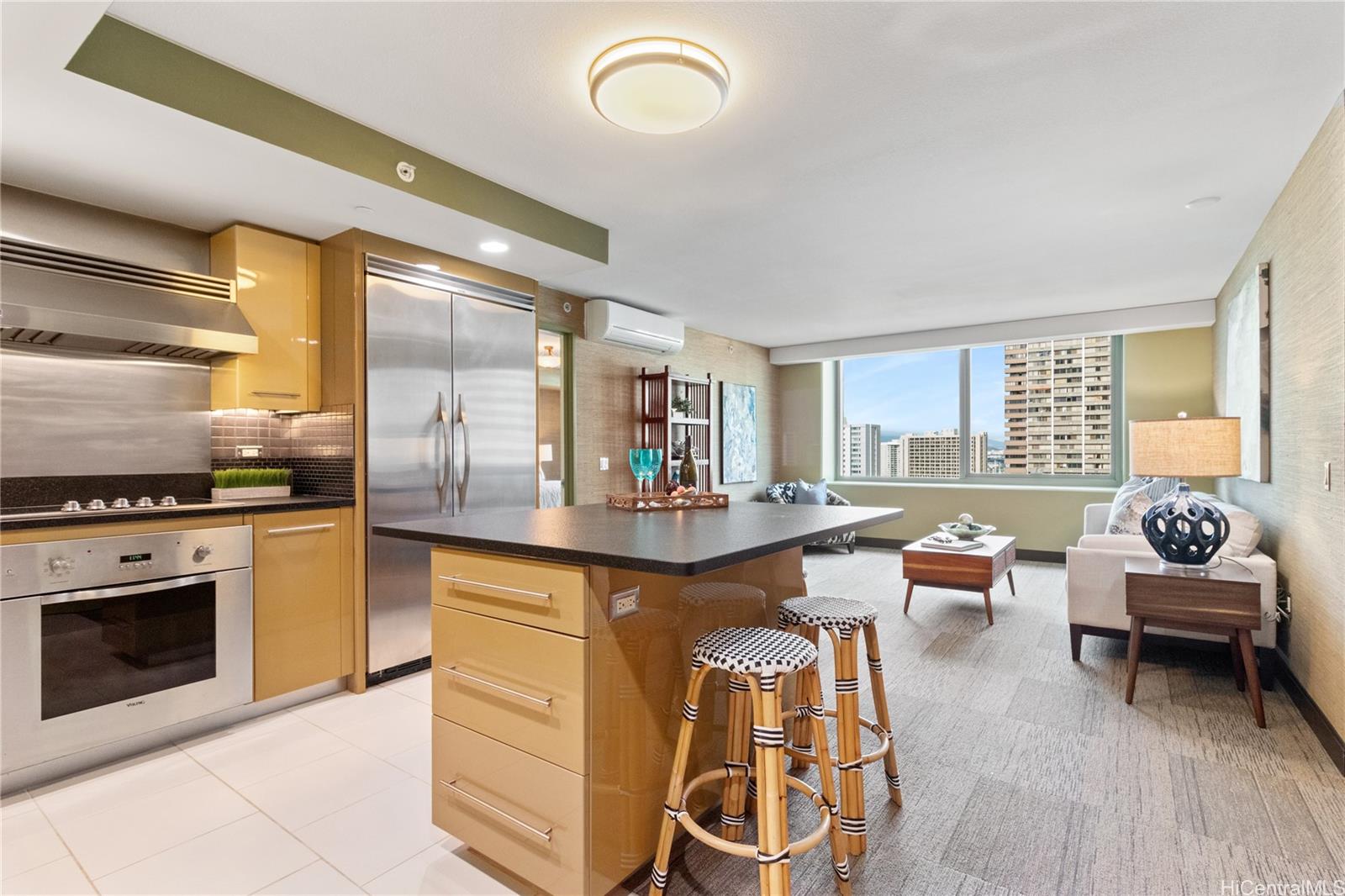 a kitchen with stainless steel appliances granite countertop a stove and a refrigerator