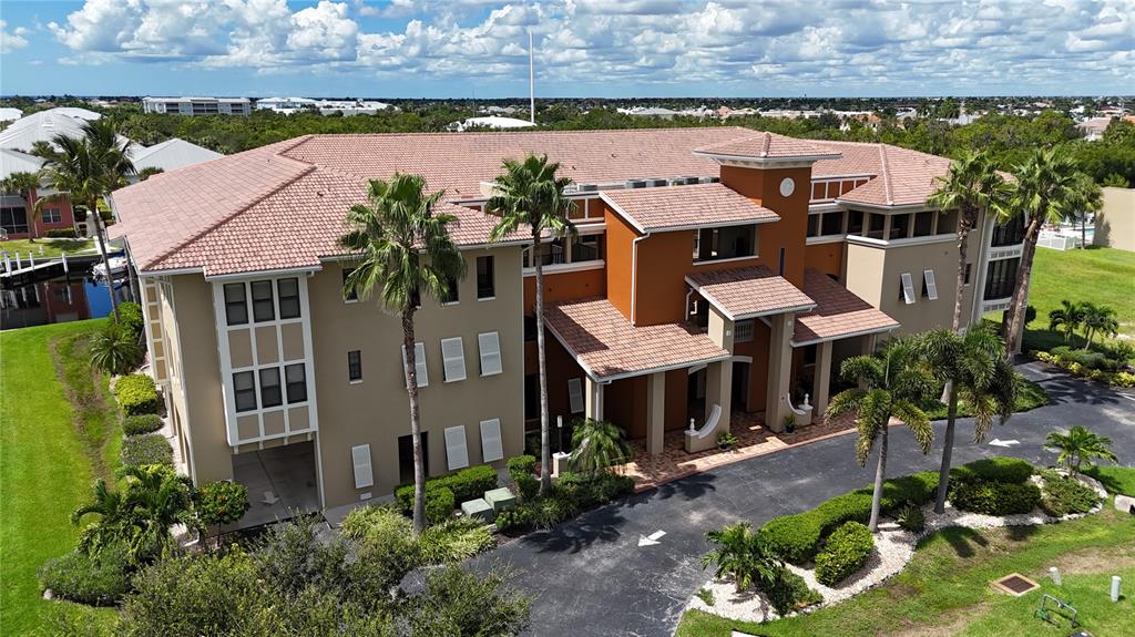 an aerial view of multiple houses with a yard