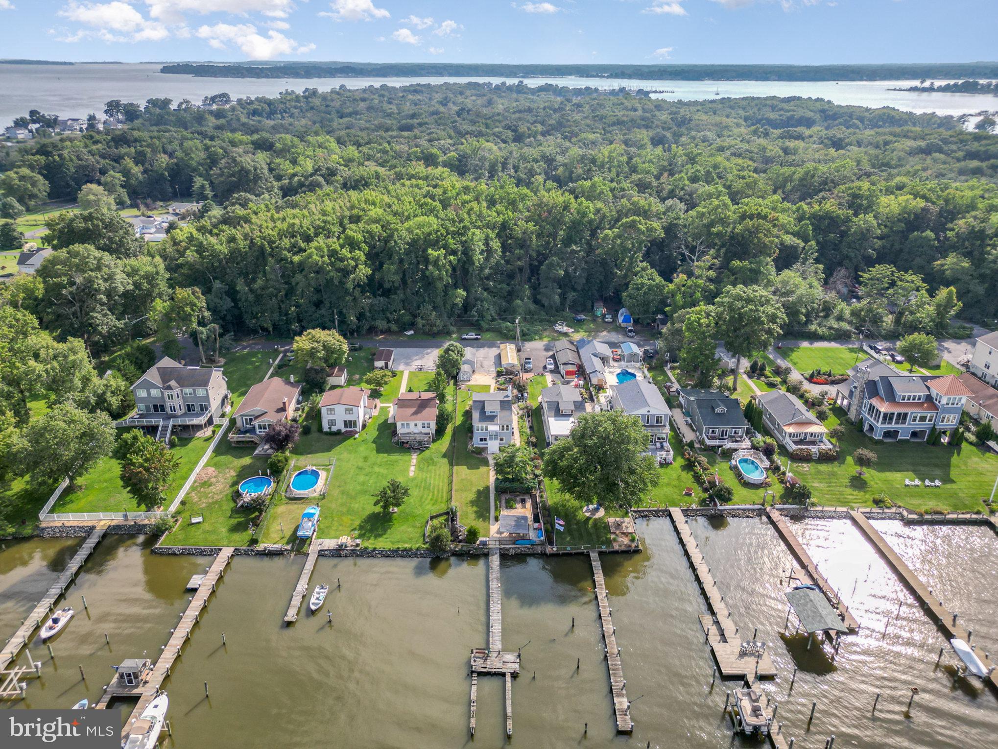 an aerial view of a houses with a yard