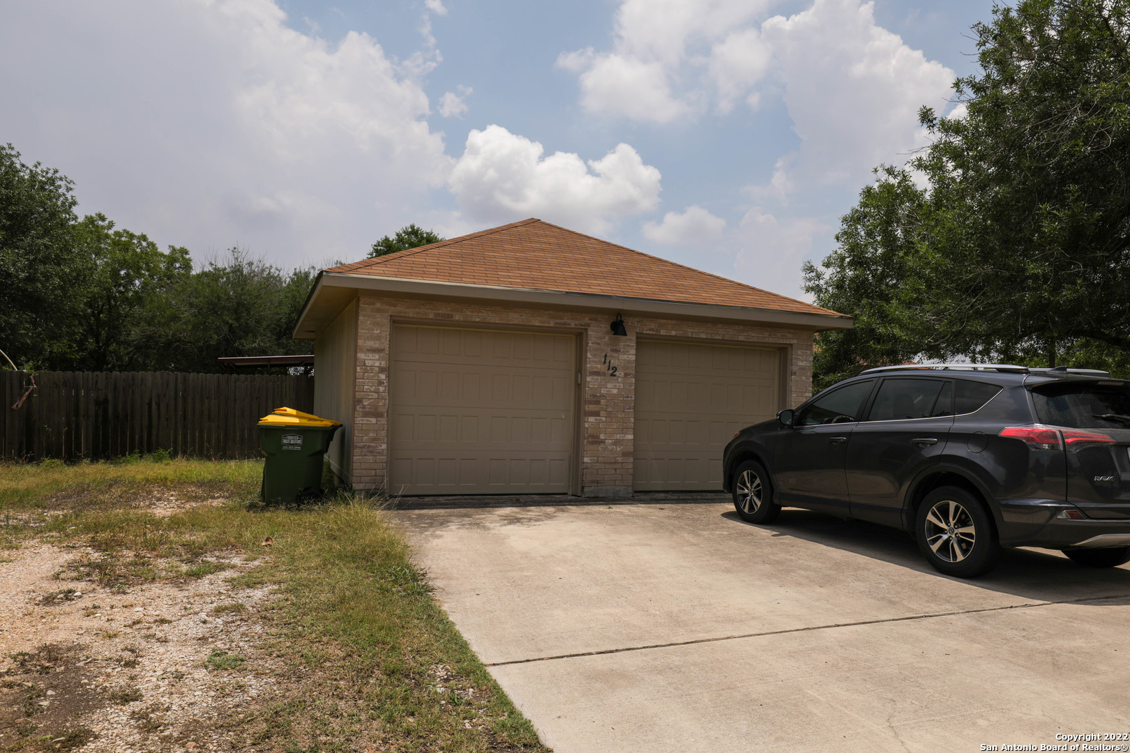 a view of a car in front of house