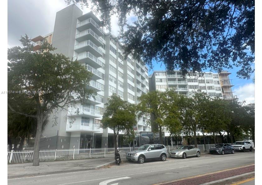 a building with trees in front of it