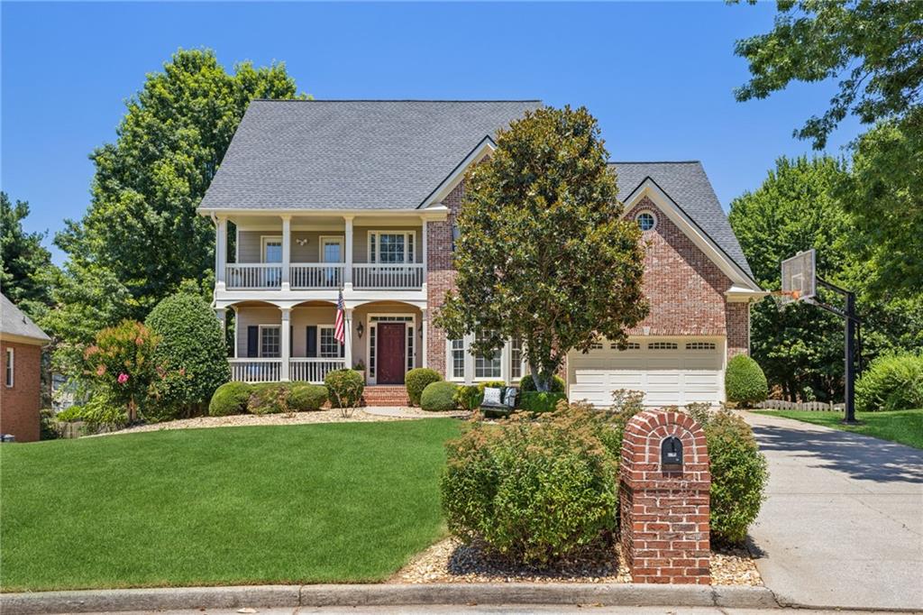 front view of a house with a yard