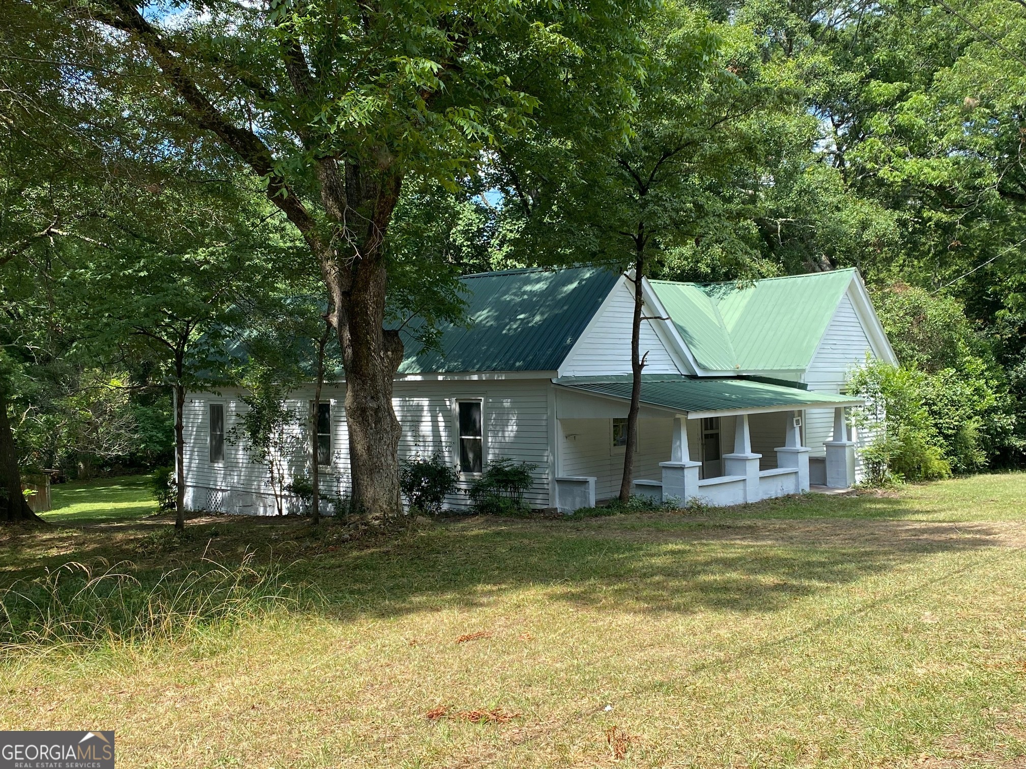 a view of house with a swimming pool