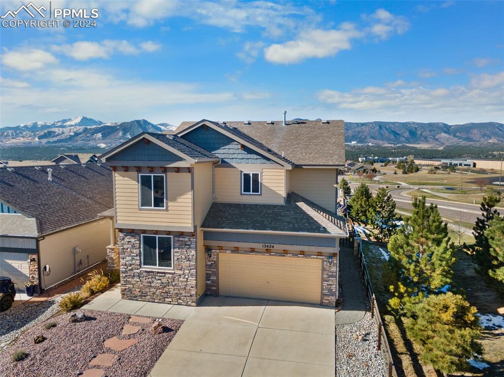 Beautiful Craftsman-style home with mountain views and a three car tandem garage