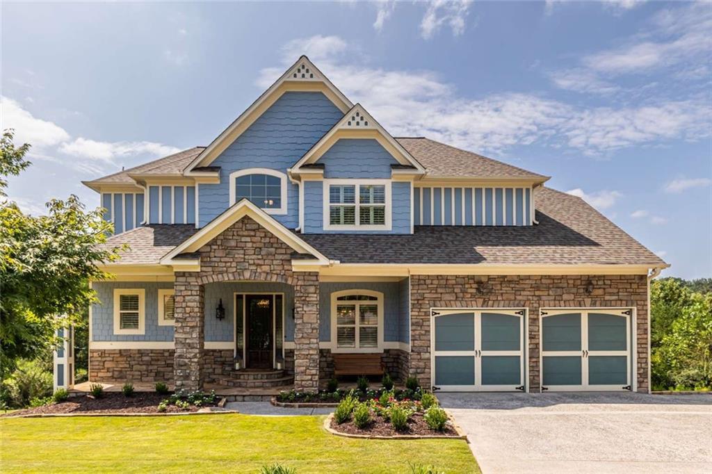 a front view of a house with yard porch and furniture