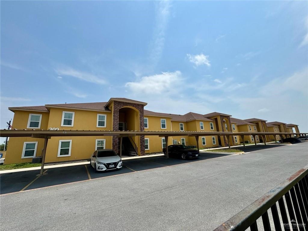 a view of a car park in front of a building