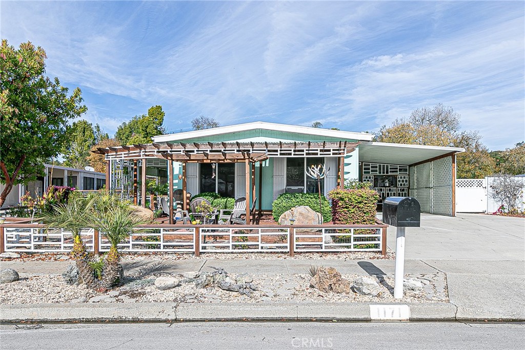 a front view of house with yard and seating