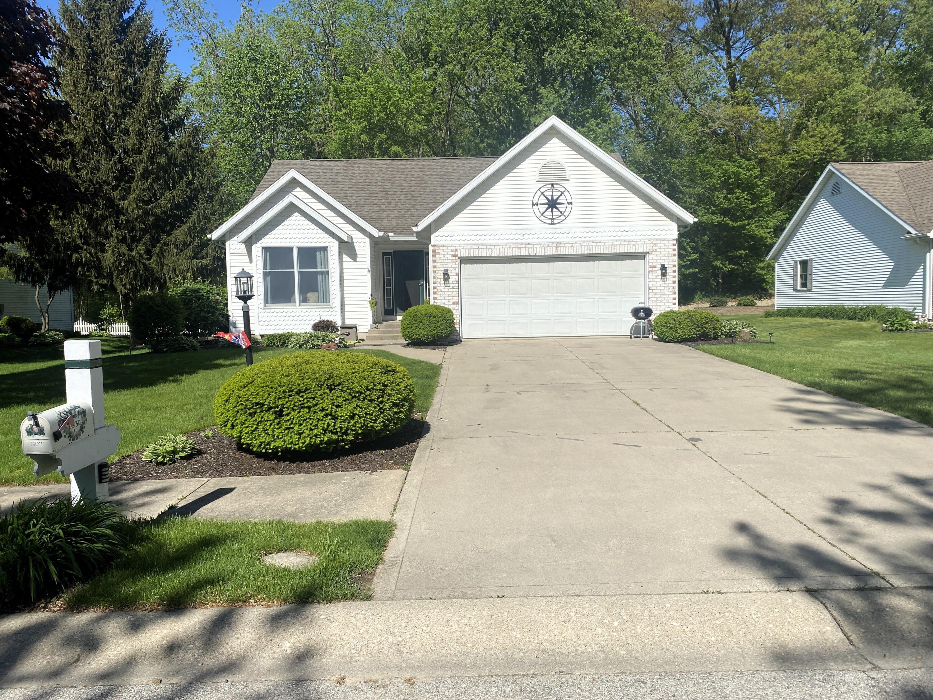 a view of house with garden