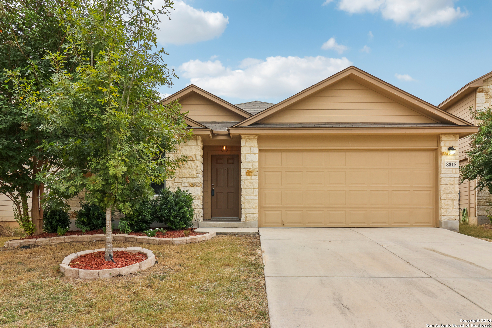 a front view of a house with a yard