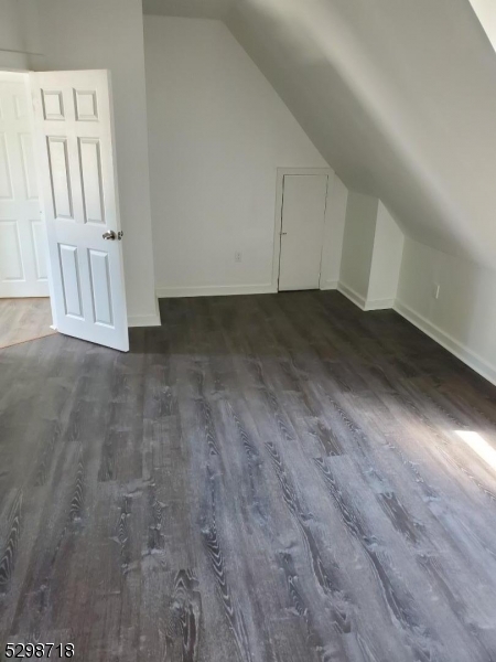 a view of a livingroom with wooden floor