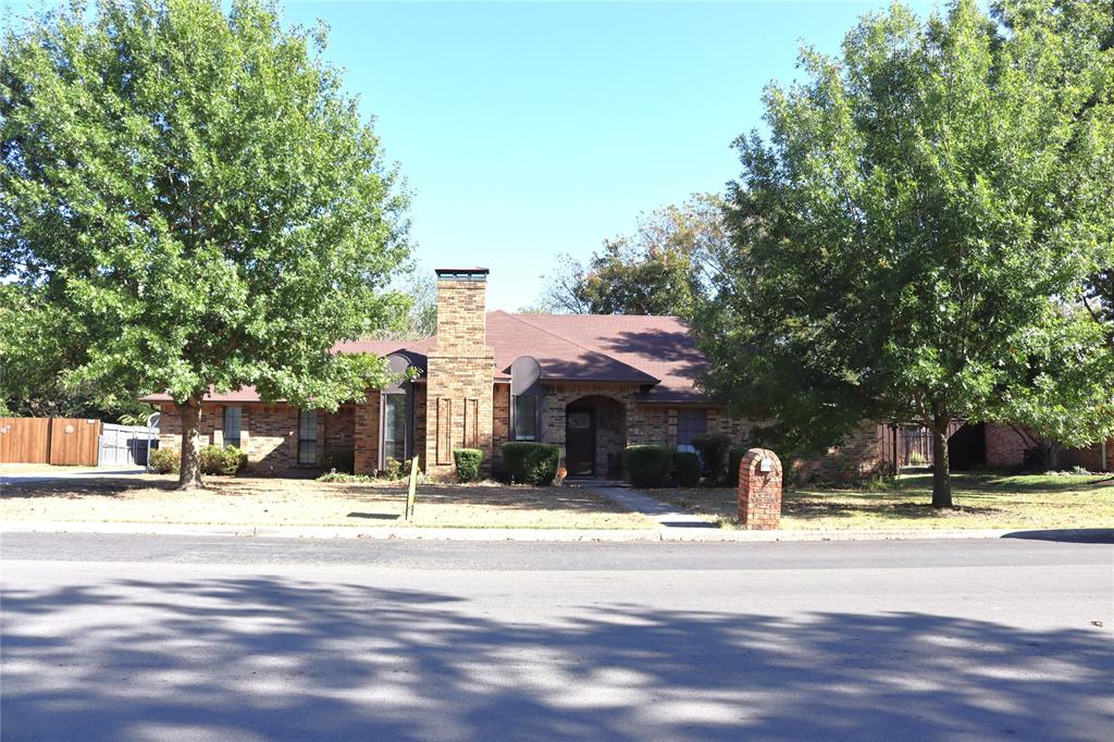 a view of the house with snow on the road