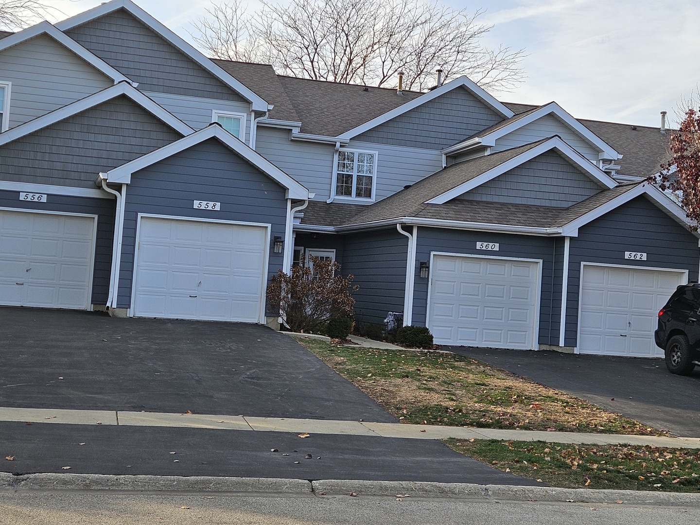 a front view of a house with a garage