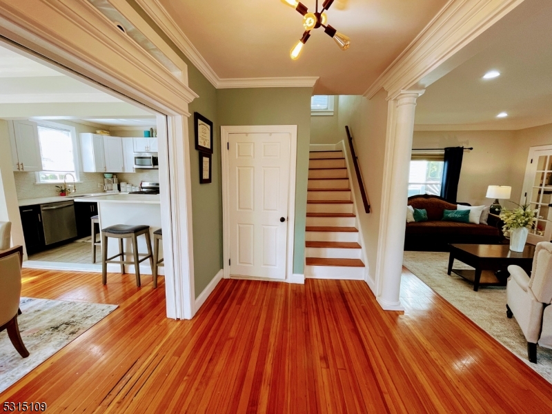 a view of a livingroom with furniture and wooden floor