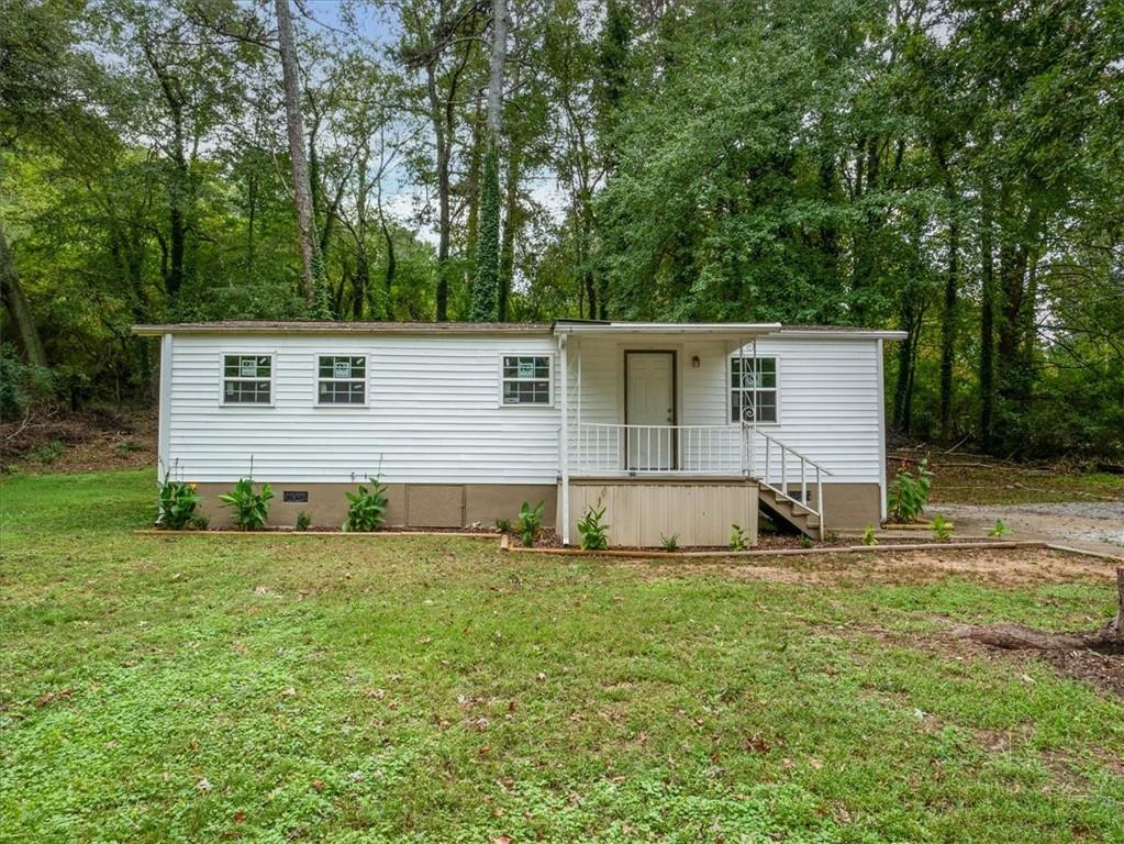 a view of a backyard with a small cabin