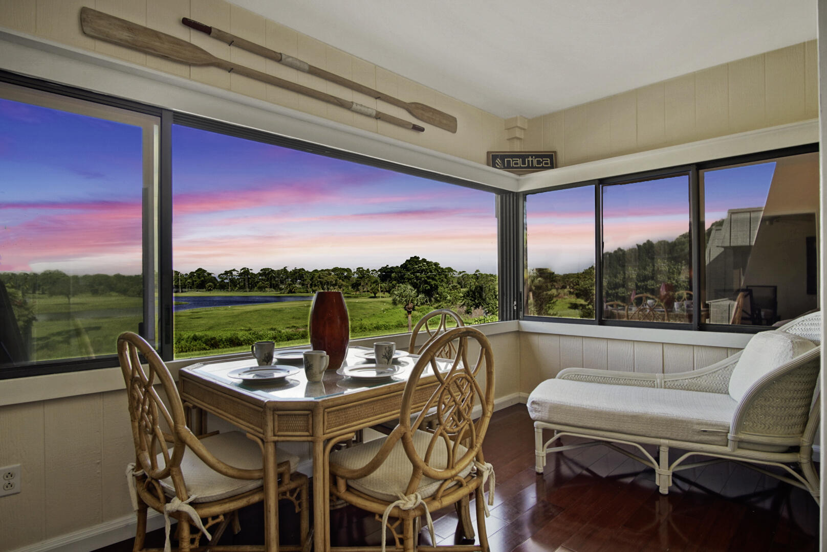 a view of a patio with dining table and chairs