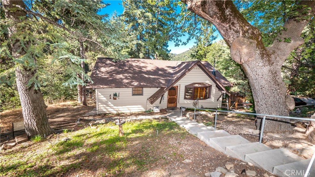 a house with trees in the background