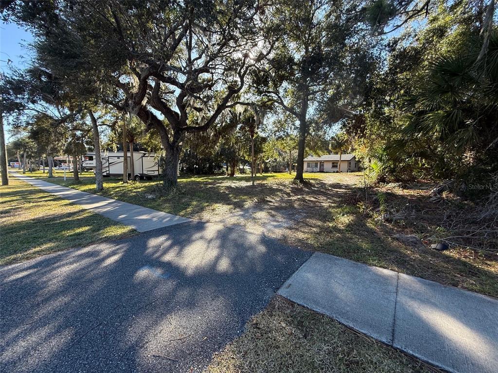 a view of a yard with an outdoor space