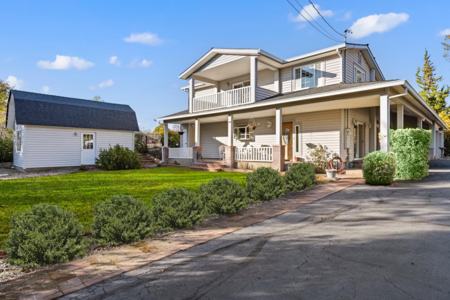 a front view of a house with garden