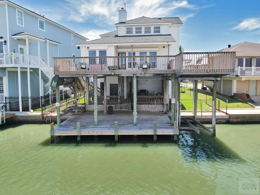 an aerial view of a house with a swimming pool