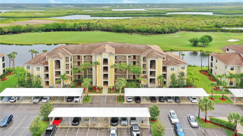 a aerial view of residential houses with outdoor space and swimming pool