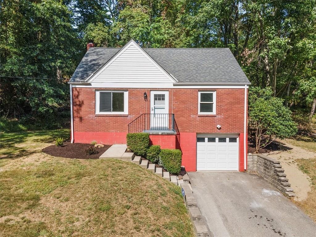 front view of a house with a yard