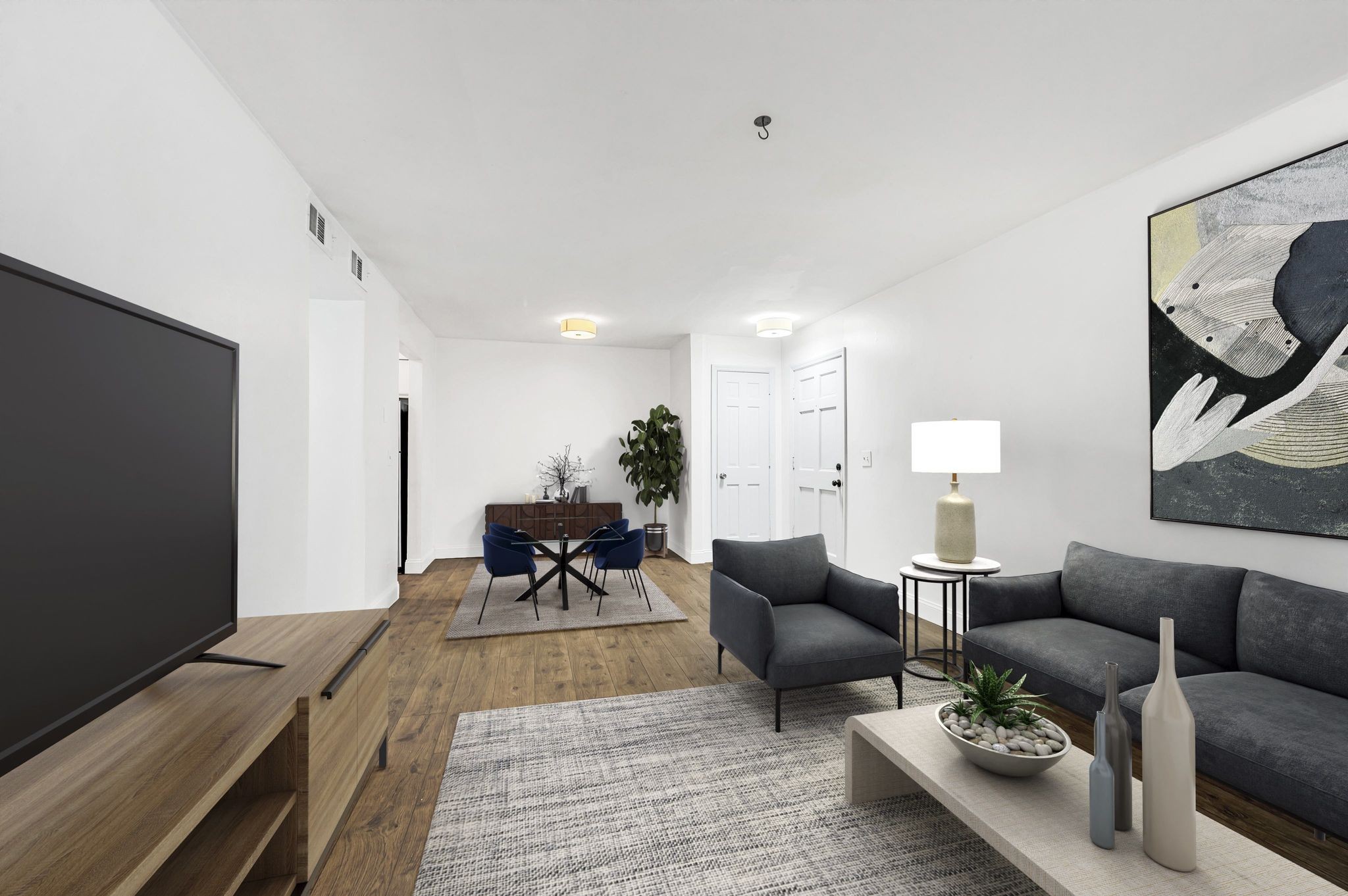 a living room with furniture and a flat screen tv