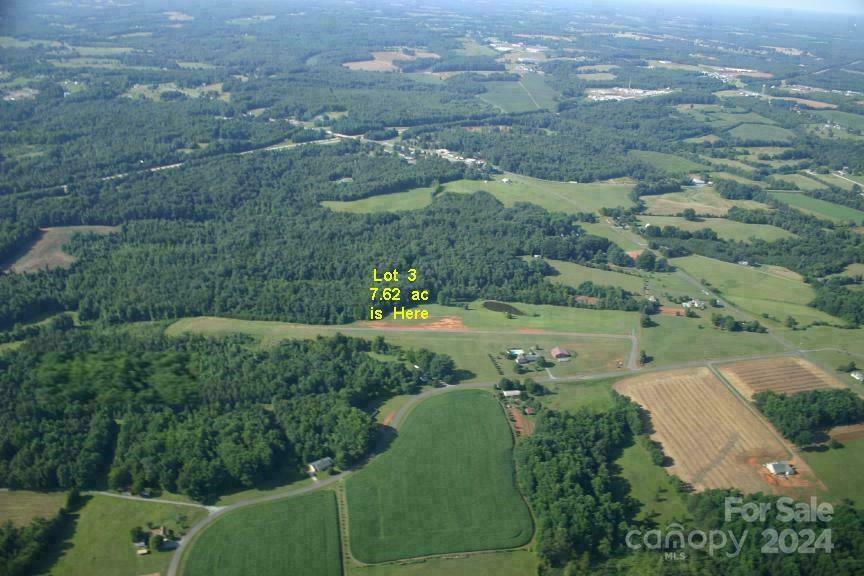 an aerial view of a yard with a garden