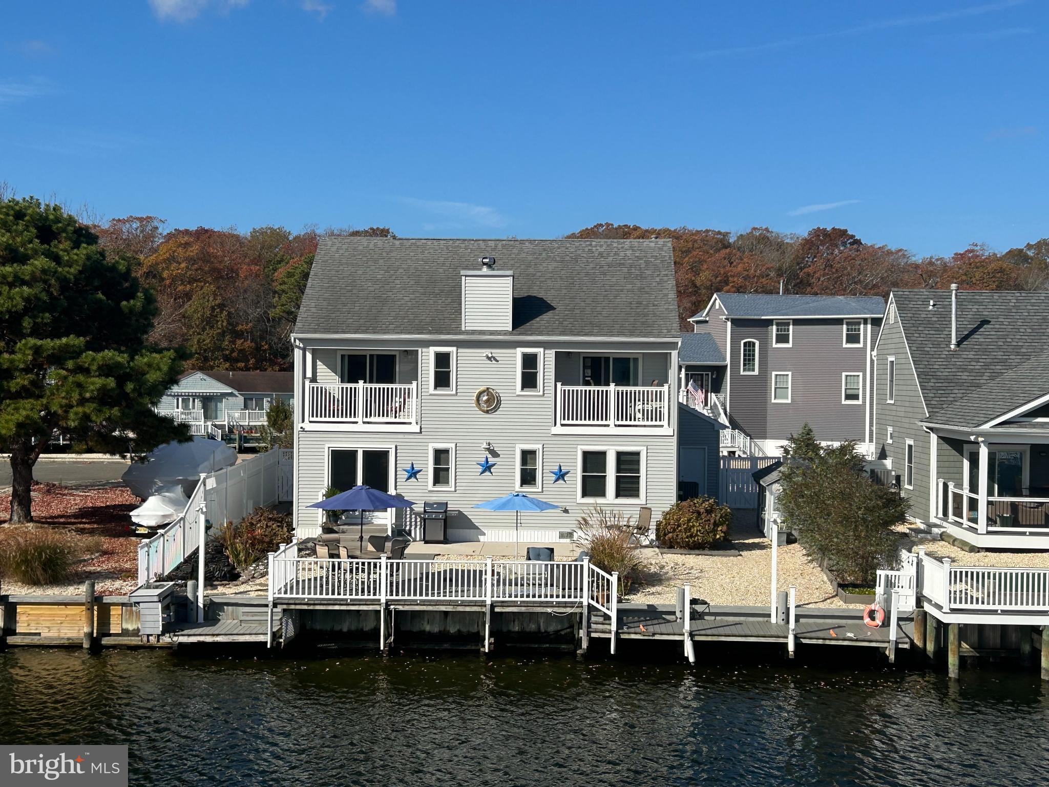 a view of a lake with outdoor seating