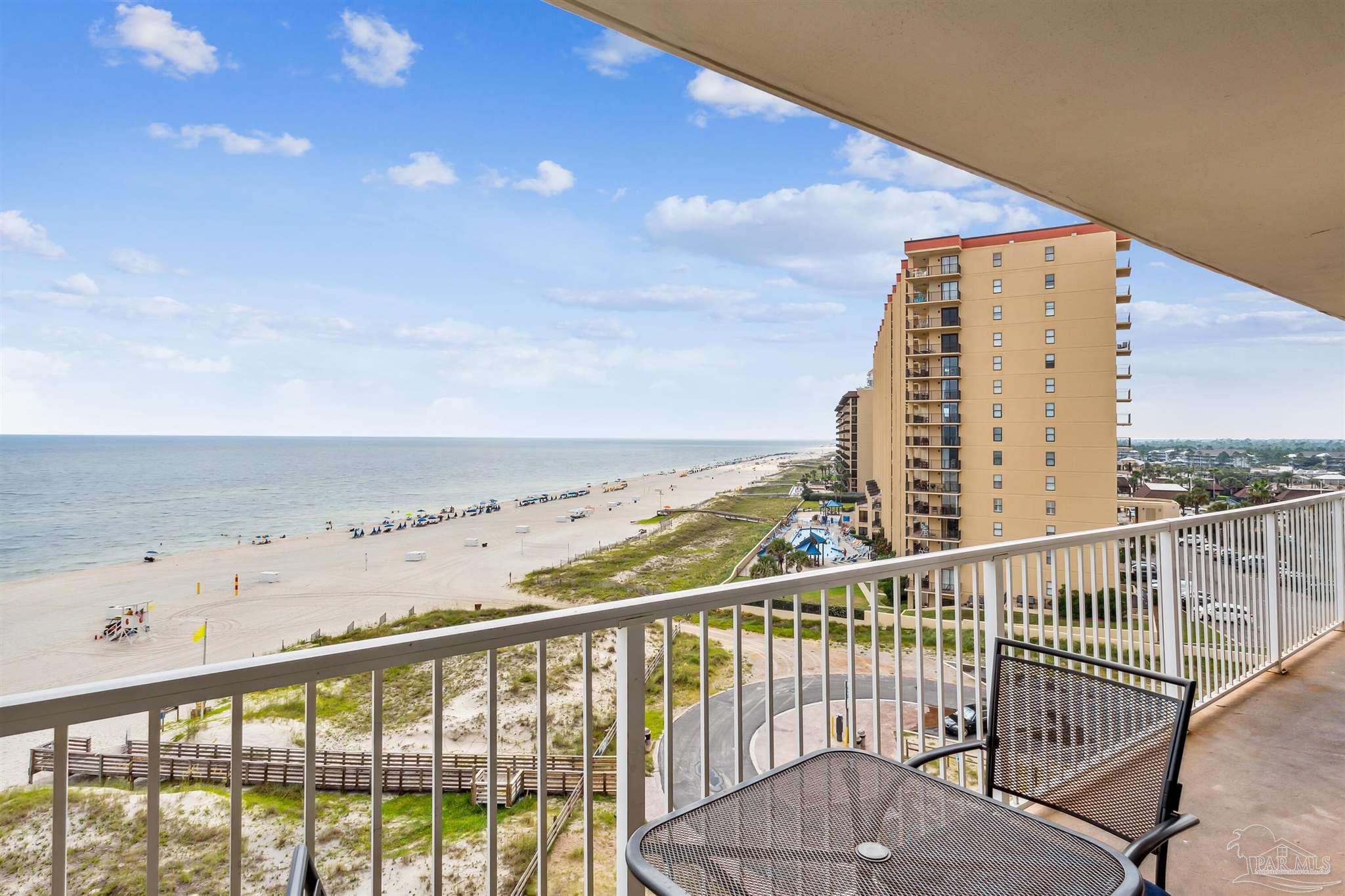 a view of a balcony with an ocean view