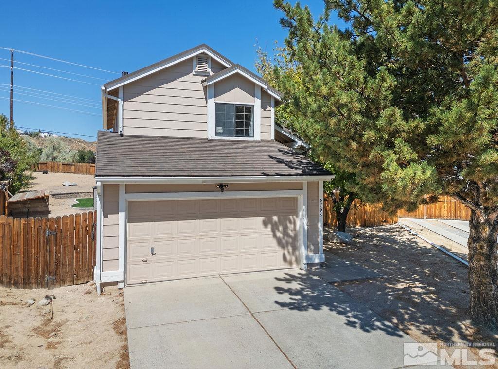 a view of a house with a garage