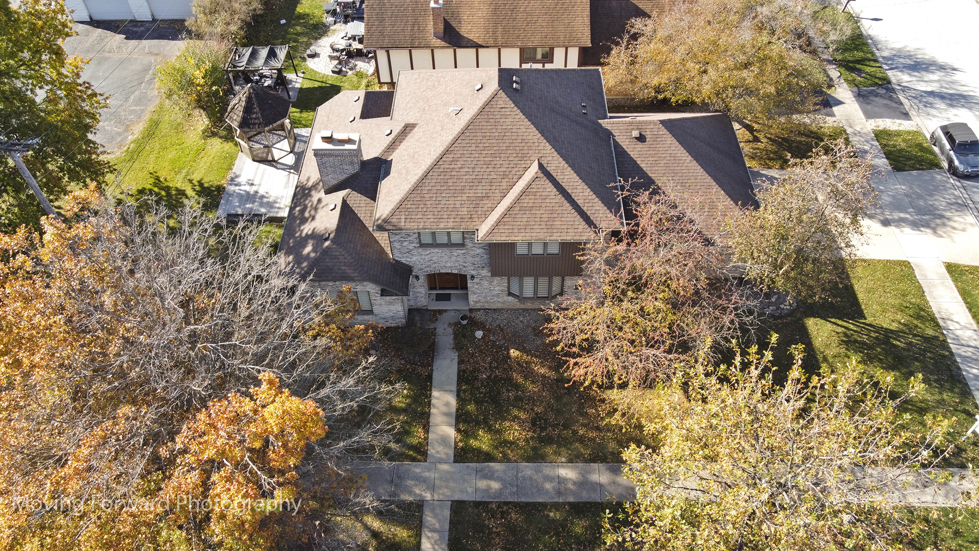 a aerial view of a house with a yard and garden