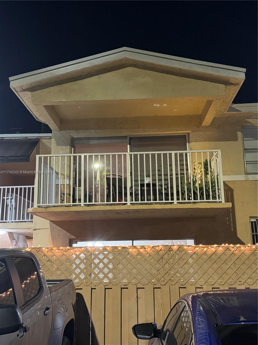 a view of balcony with wooden floor